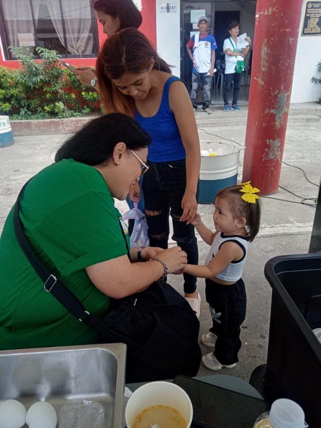 Ms. Sary with kids.jpg